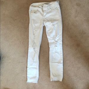 Distressed white jeans